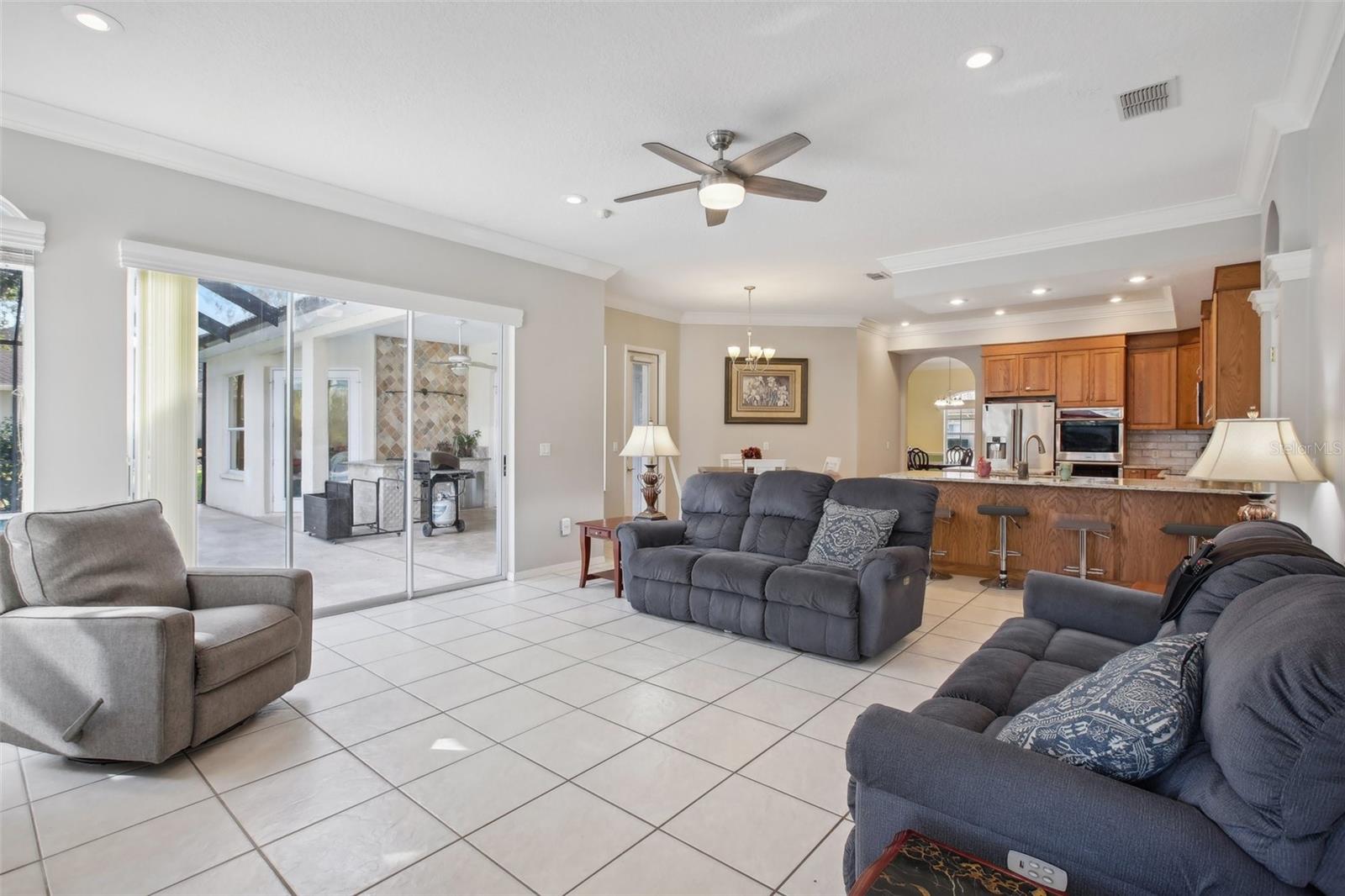 Light and bright family room open to kitchen and outdoor living space.