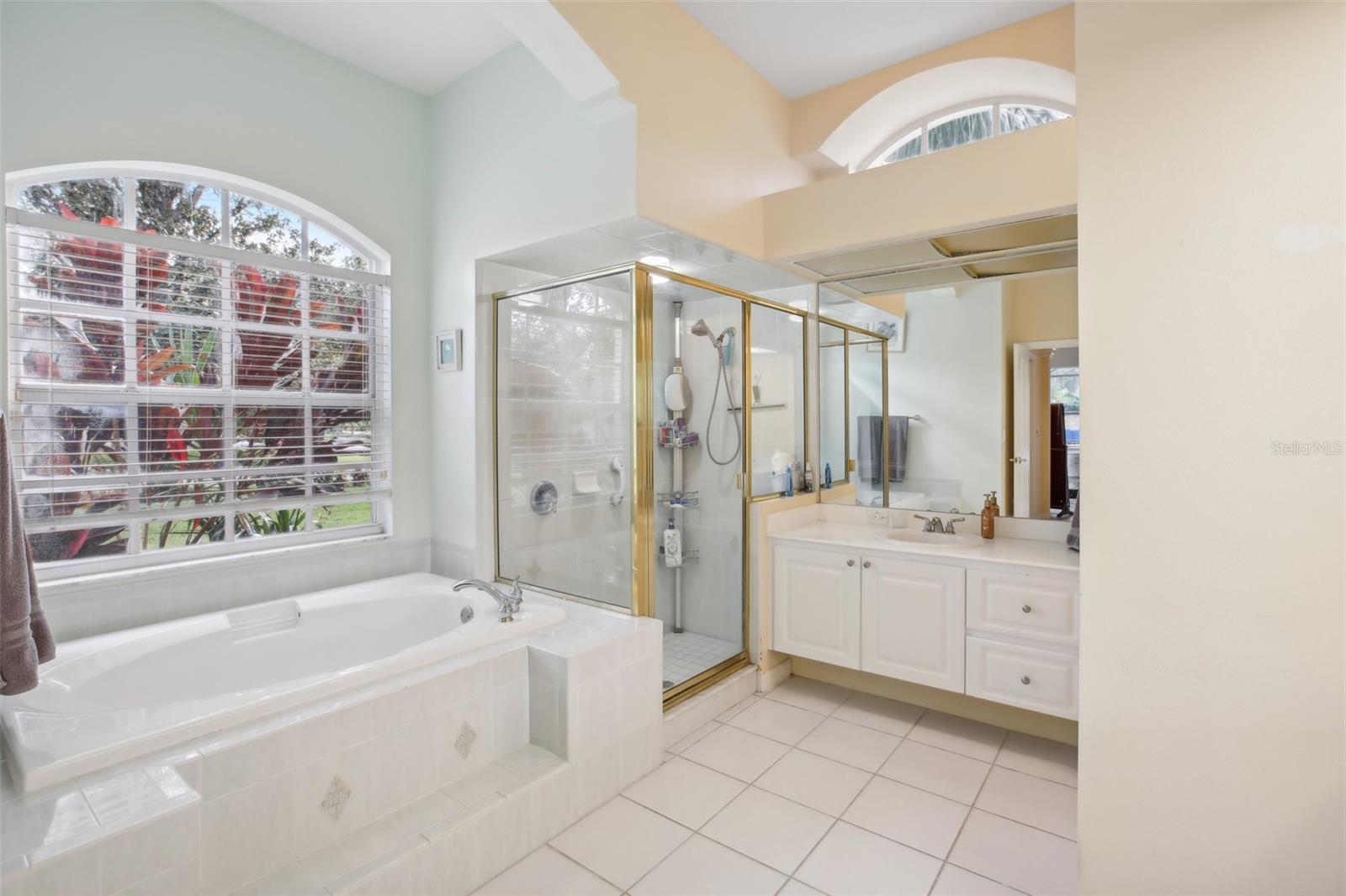 Enormous owners ensuite provides relaxing tub time or the quick shower option.