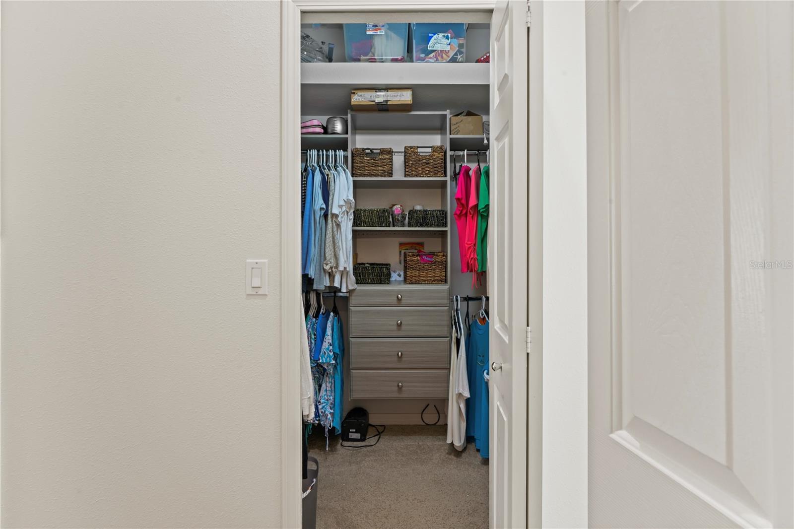 Dual Walk-in closets with built-ins