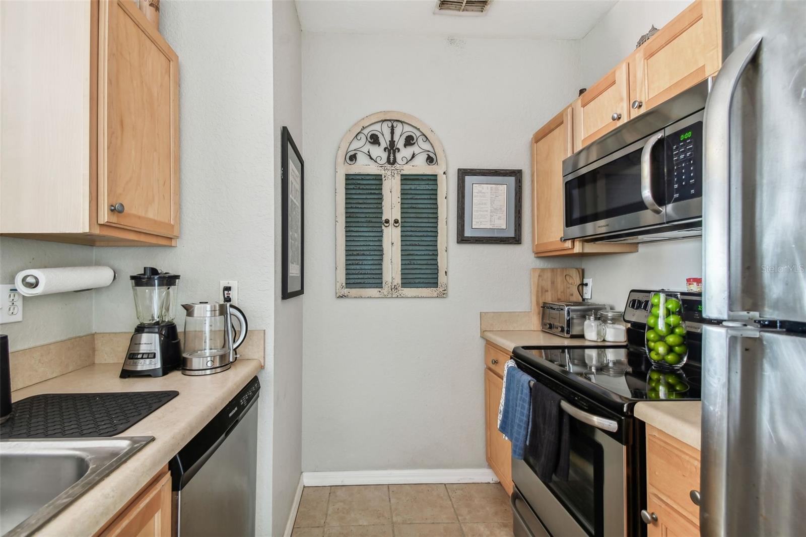 Kitchen has Stainless Steel Appliances and Pantry