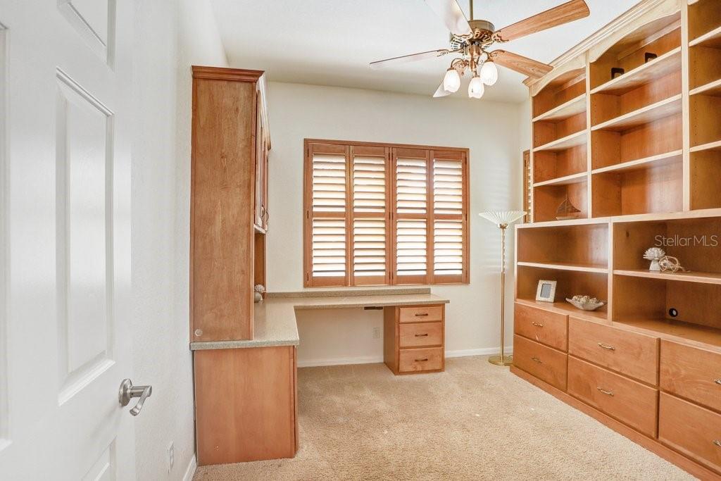 2nd bedroom with custom shelving