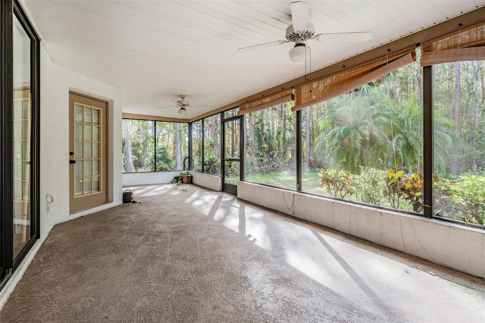 Expansive screened-in patio with conservation views