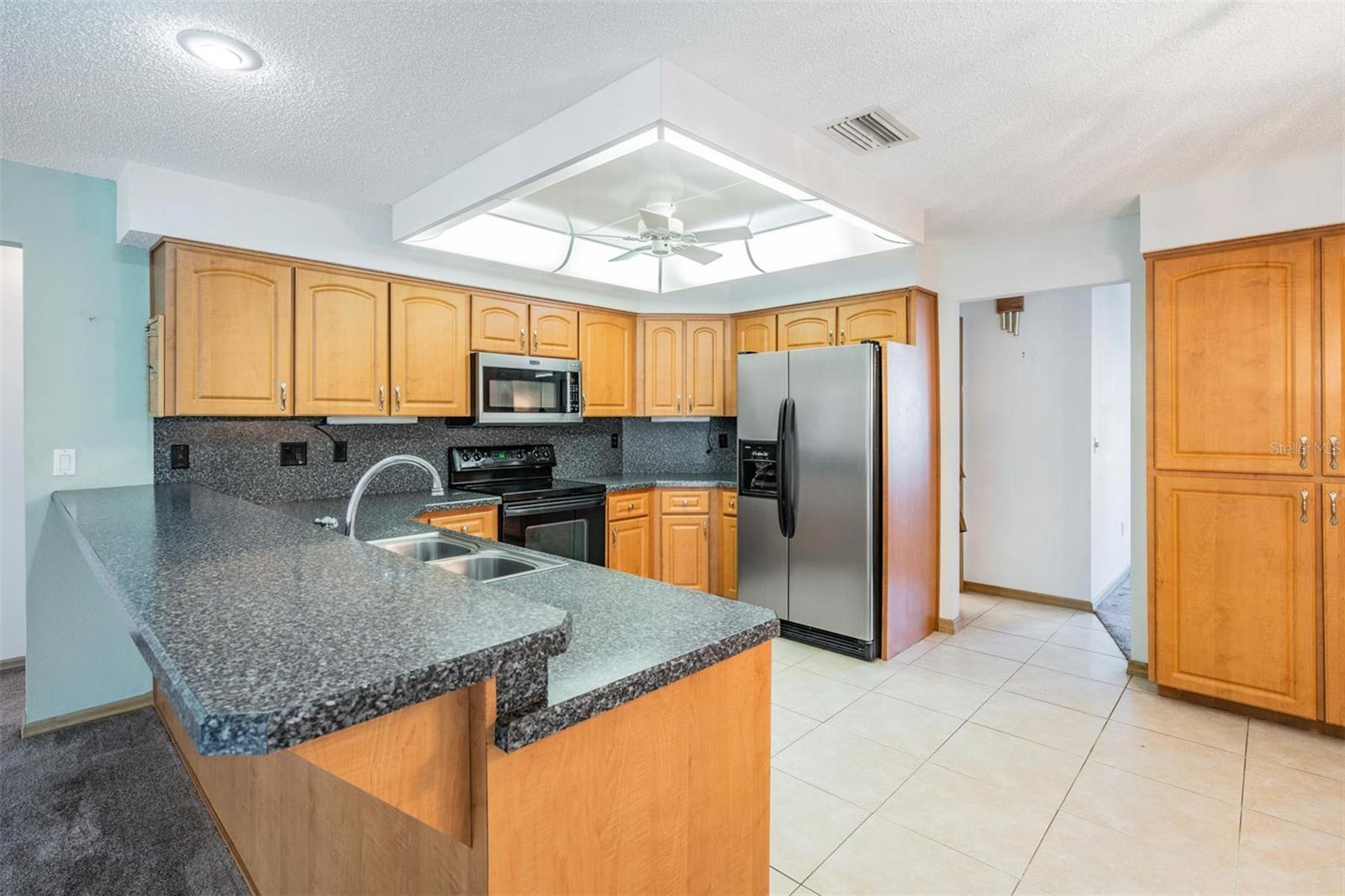 Large breakfast bar with convenient optional seating for a quick bite