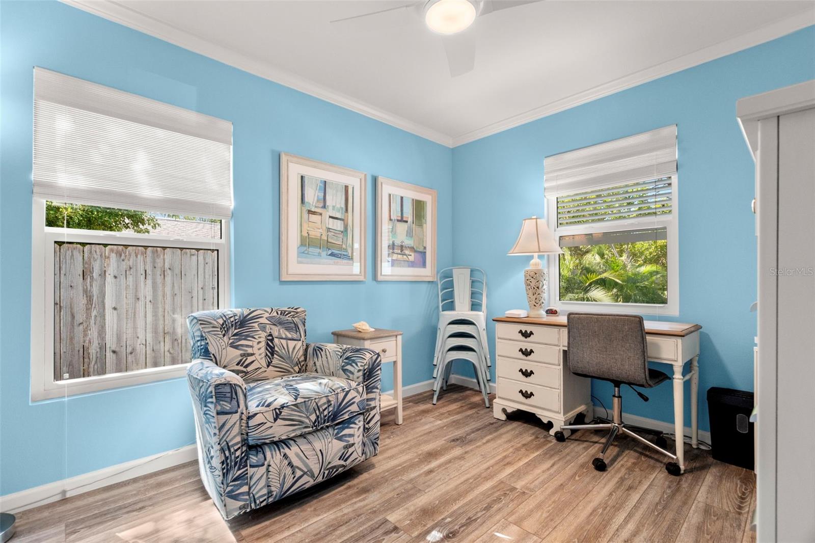 Guest bedroom with custom shades, new windows and LVP flooring.