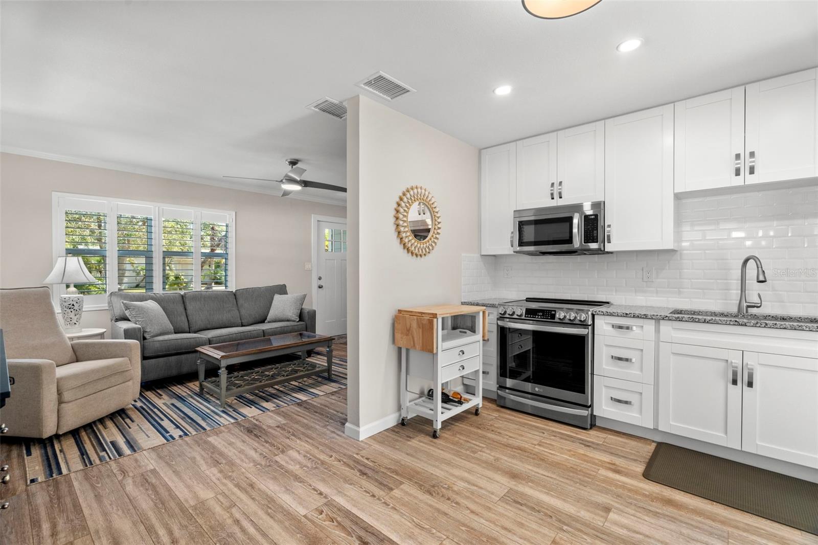 The living room opens into a thoughtfully crafted kitchen.