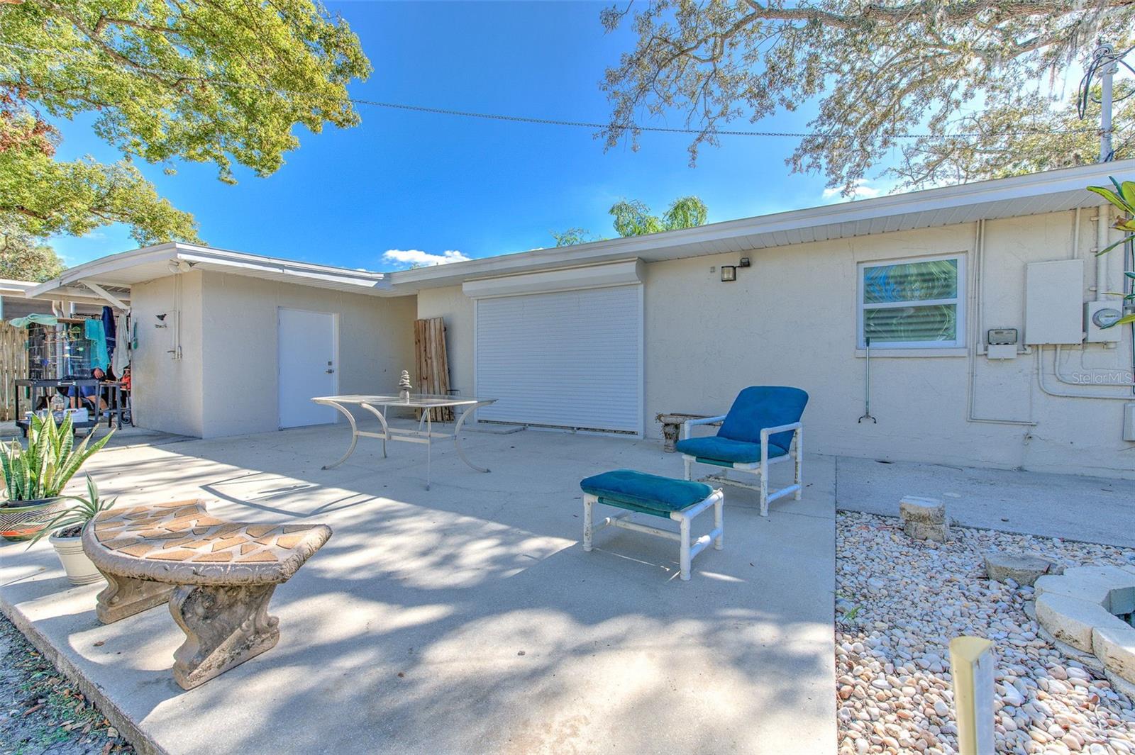 Back yard with hurricane protection roll down door