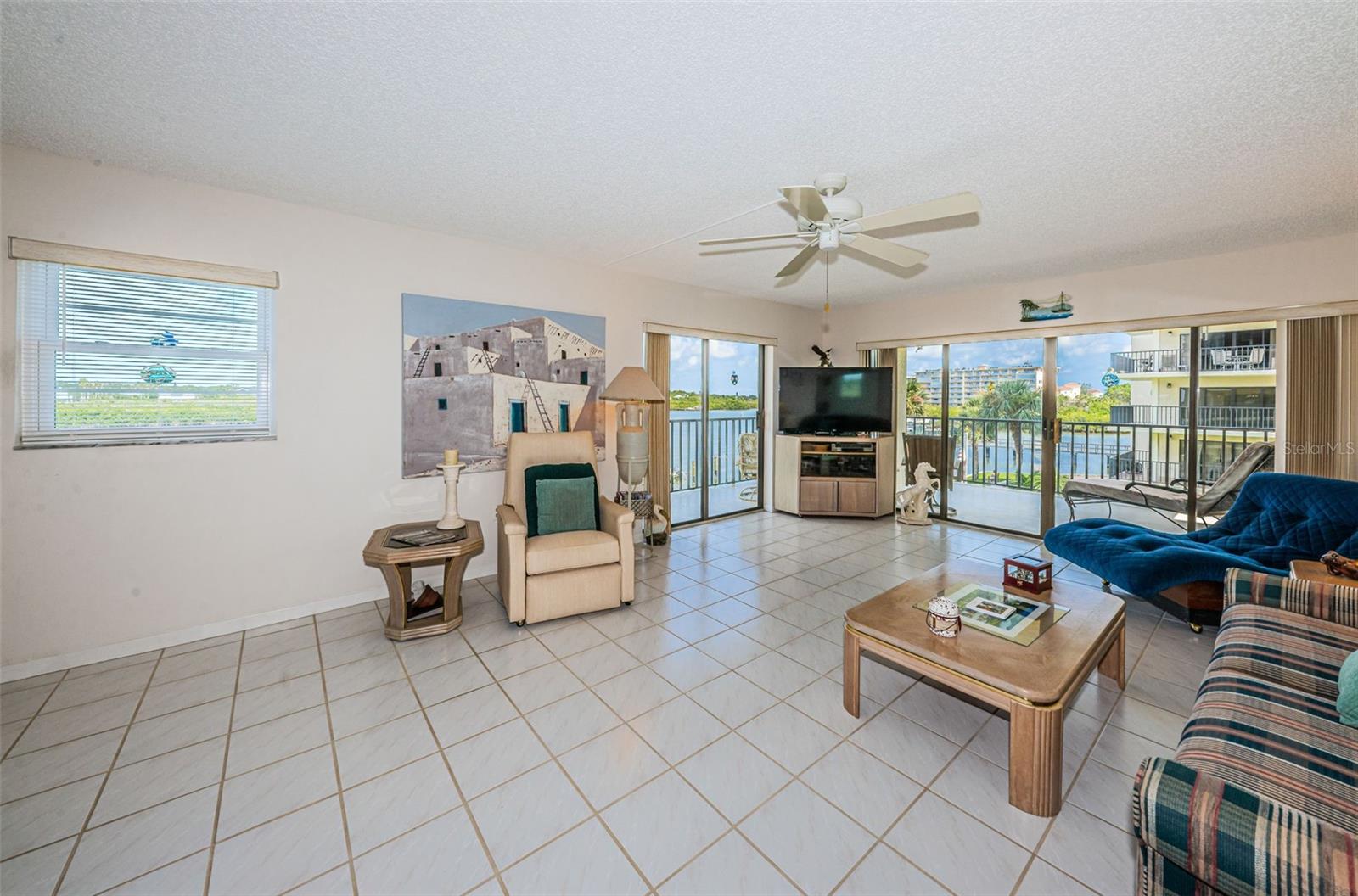 .. Corner Unit Has an Open Floorplan with a Wraparound Balcony. View From Dining Area Towards Living Room.