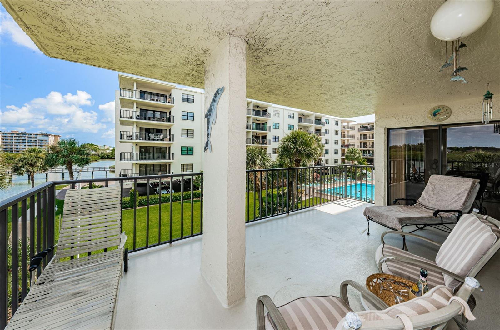 .. Large Balcony - Perfect for Entertaining or Just Enjoying Life. Pool Set Back to Right of Unit.. Just Enough Not to Hear the Din..