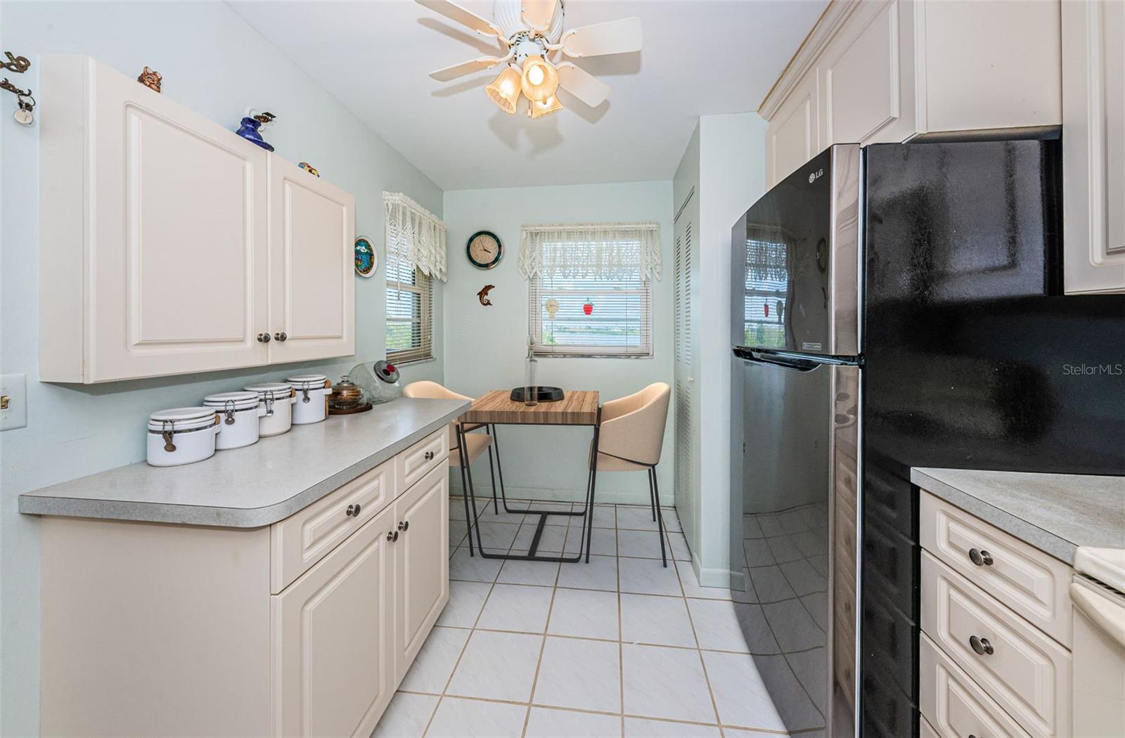 .. Kitchen With Table.. Water View From Kitchen Window.. Washer & Dryer in Corner Behind By-Folds.