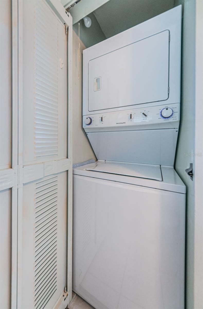 .. Laundry Area in Kitchen by Entrance Wall. Next to Fridge Area..