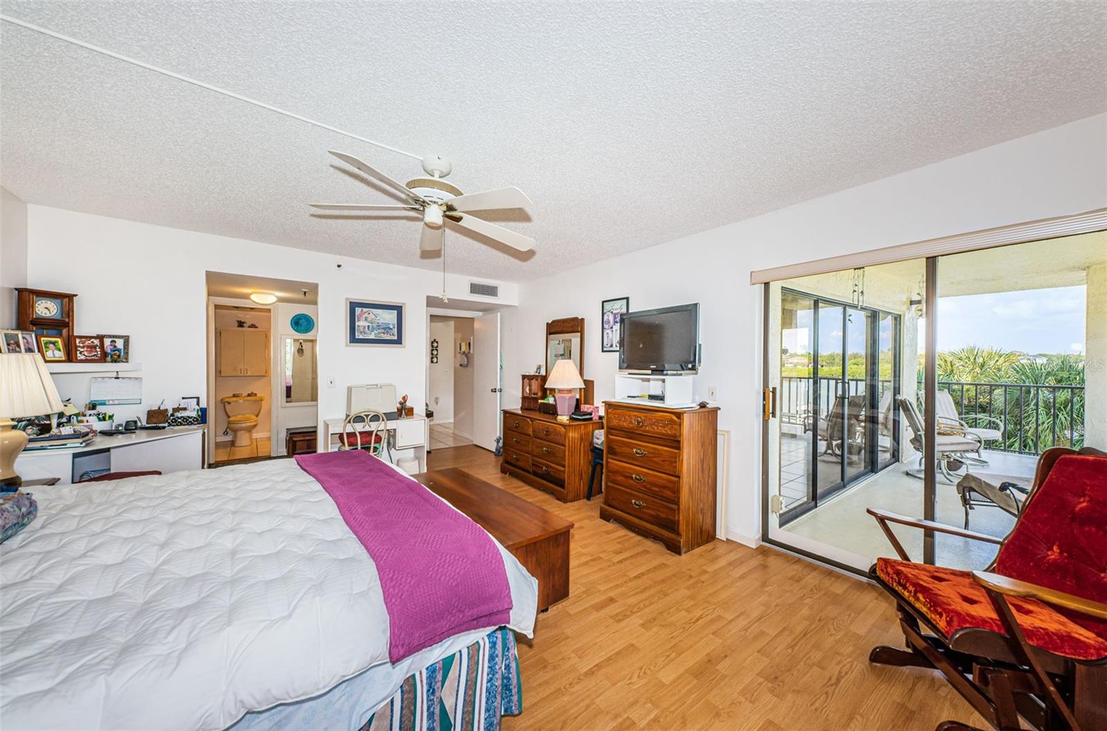 ... View to Master Bathroom on Left - Hallway in the Middle and Balcony on Right..