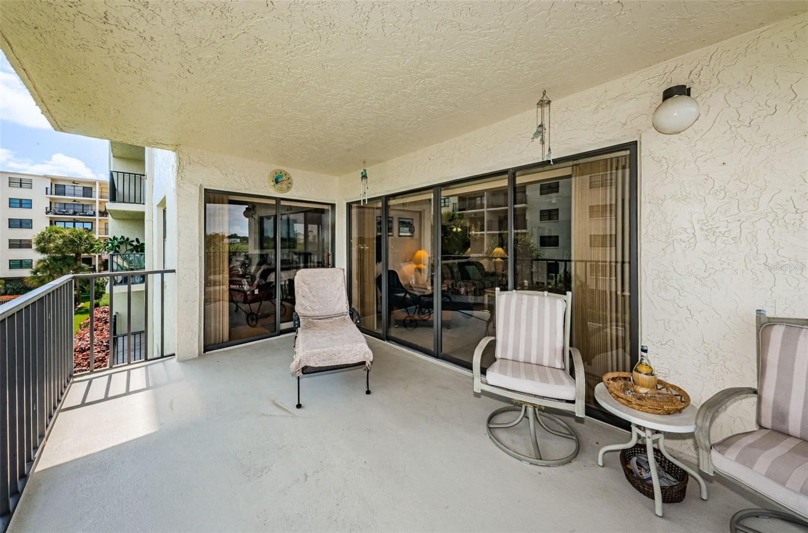 ... Balcony Shot Looking Into Master Bedroom & Living Room Sliders..