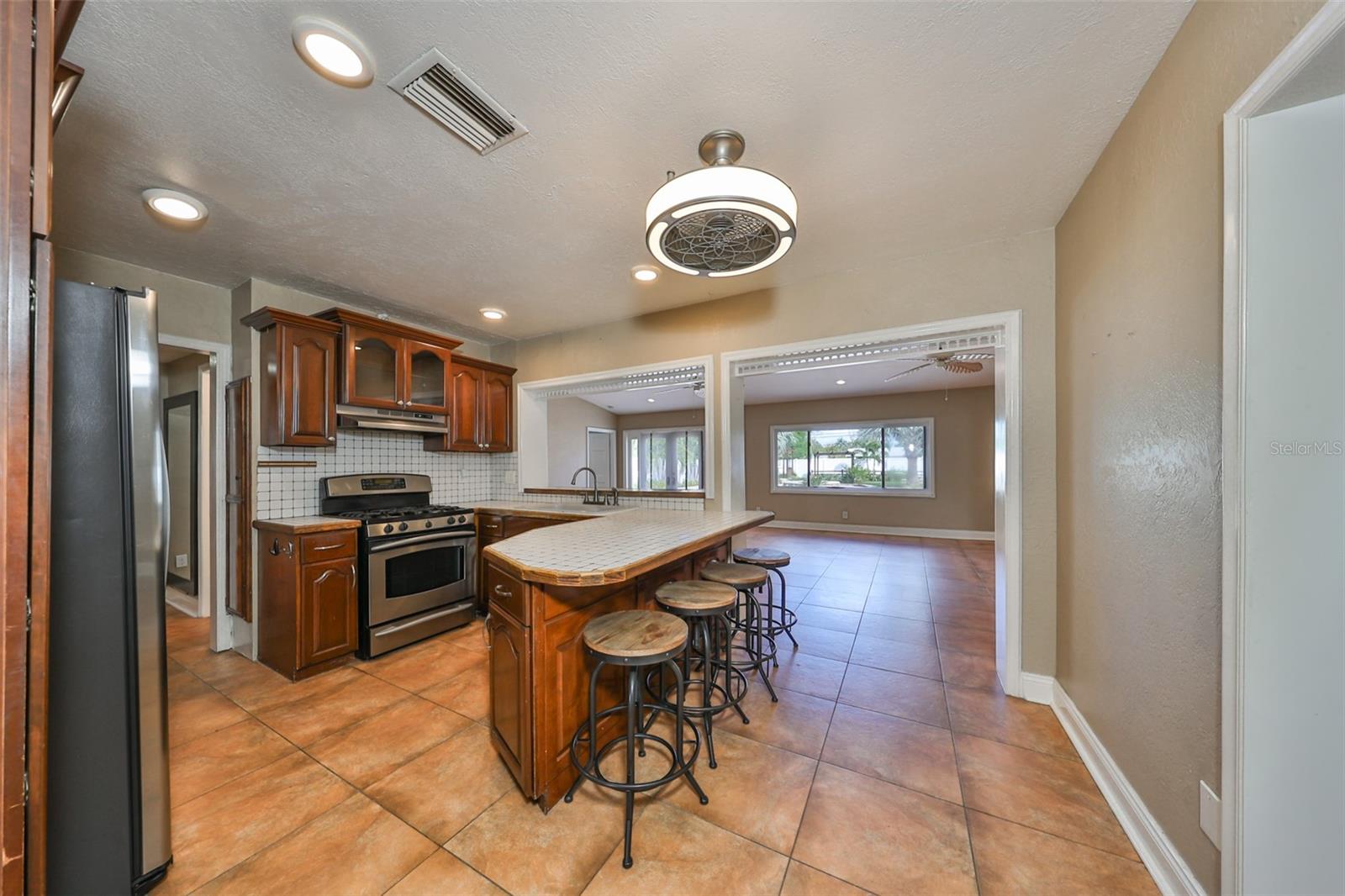 View of kitchen looking into the Great Room