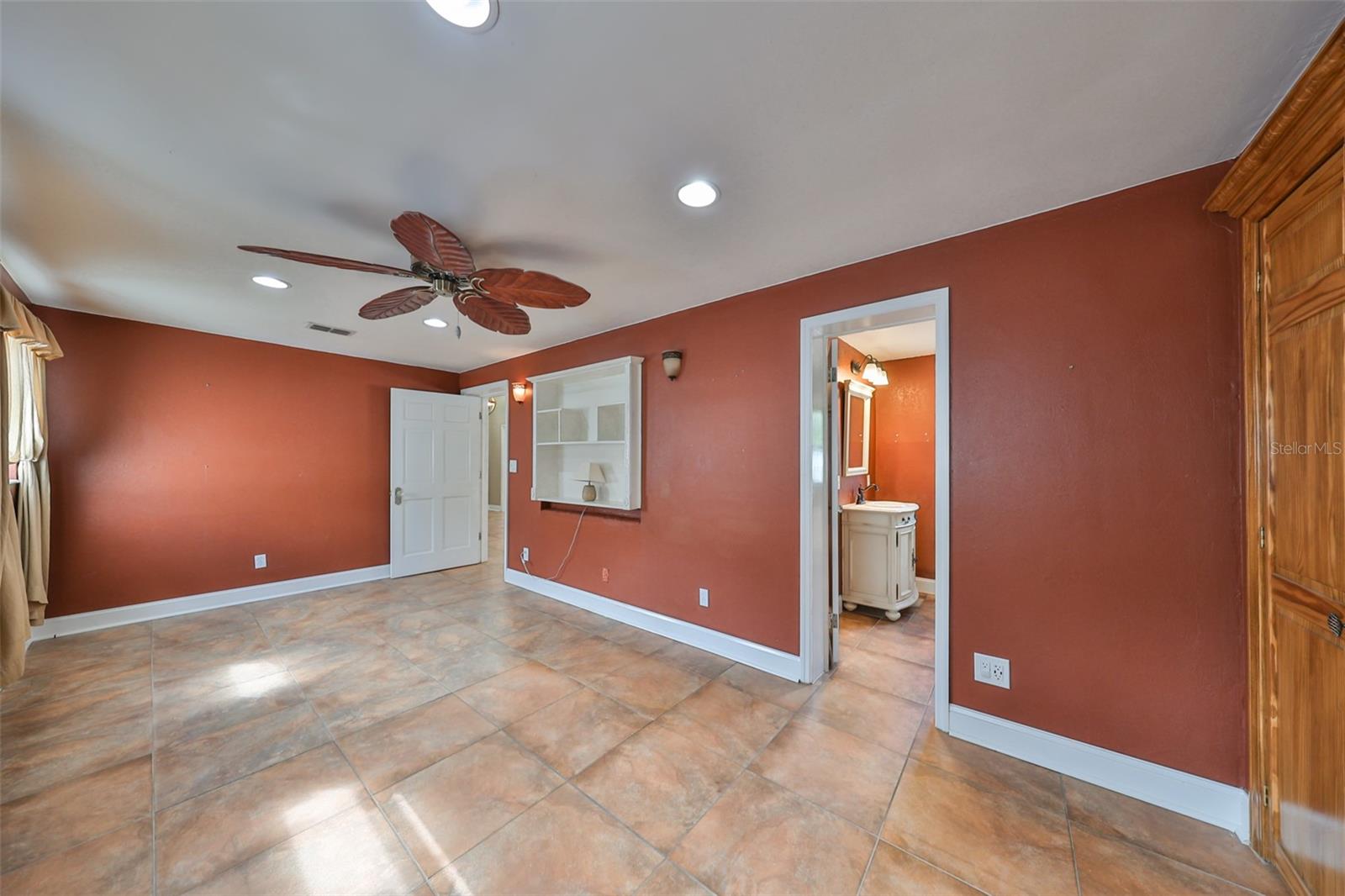 Bedroom #3 is located at the rear of the home with a doorway view to the en suite bathroom