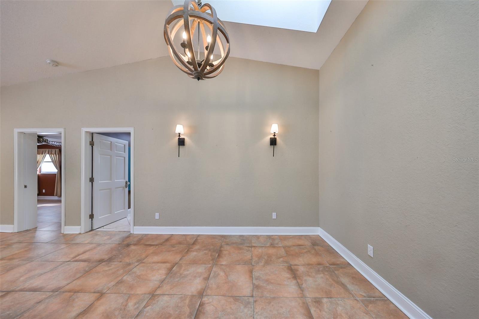 View of Dining area with wall sconces and skylight for natural light all day long