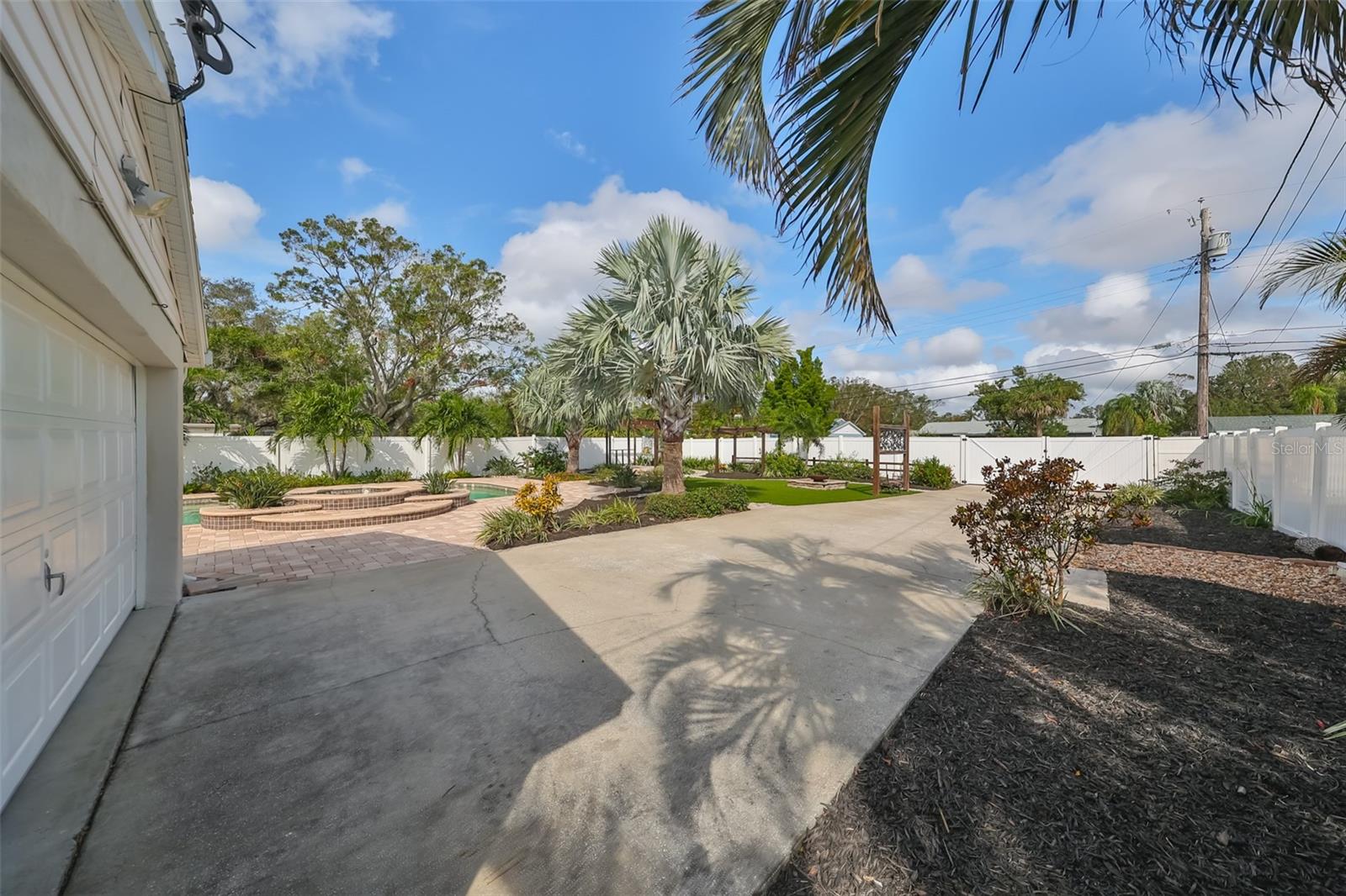 View of rear driveway from garage to rear access to alley