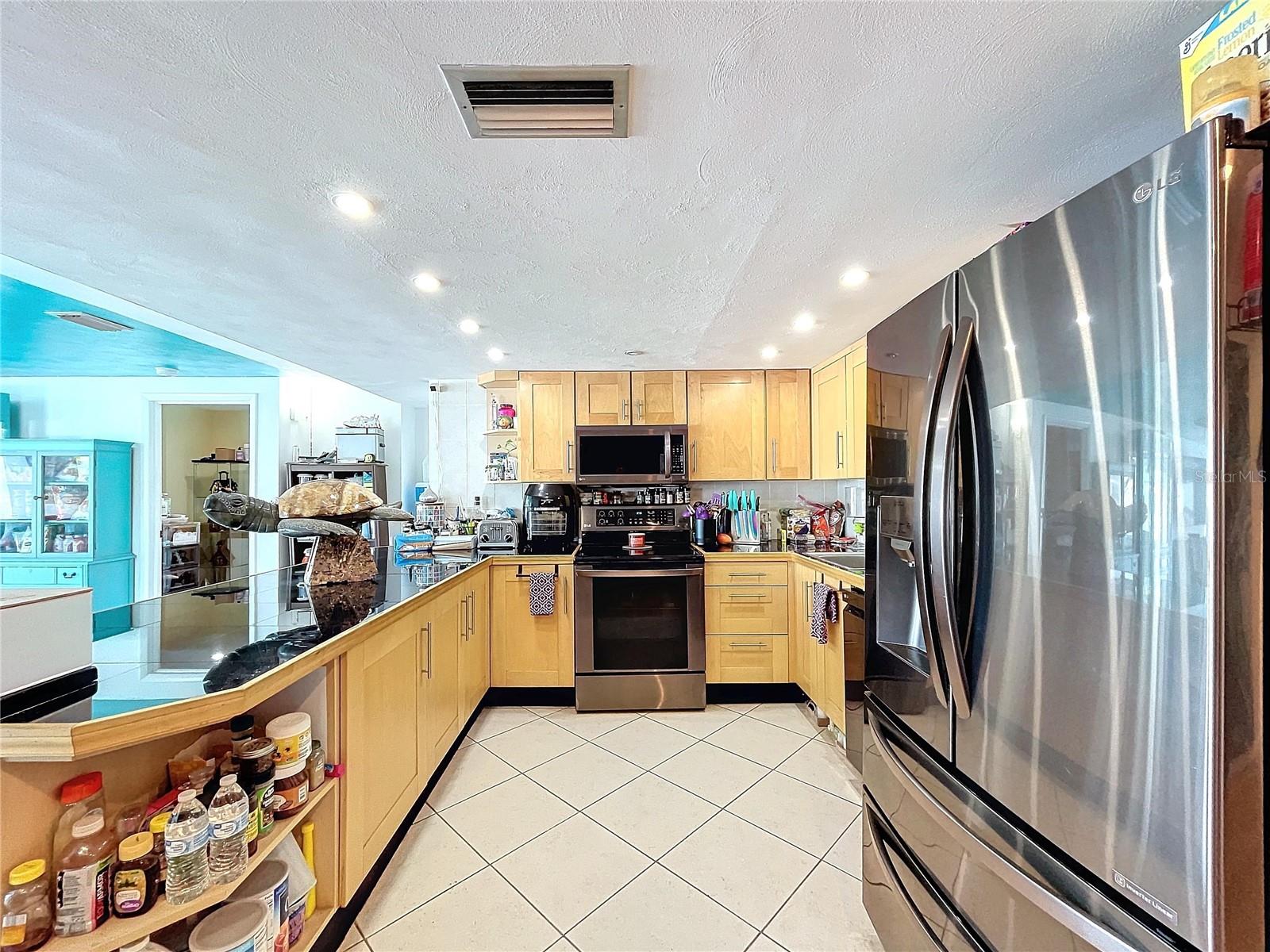 Dark stainless appliances  throughout.