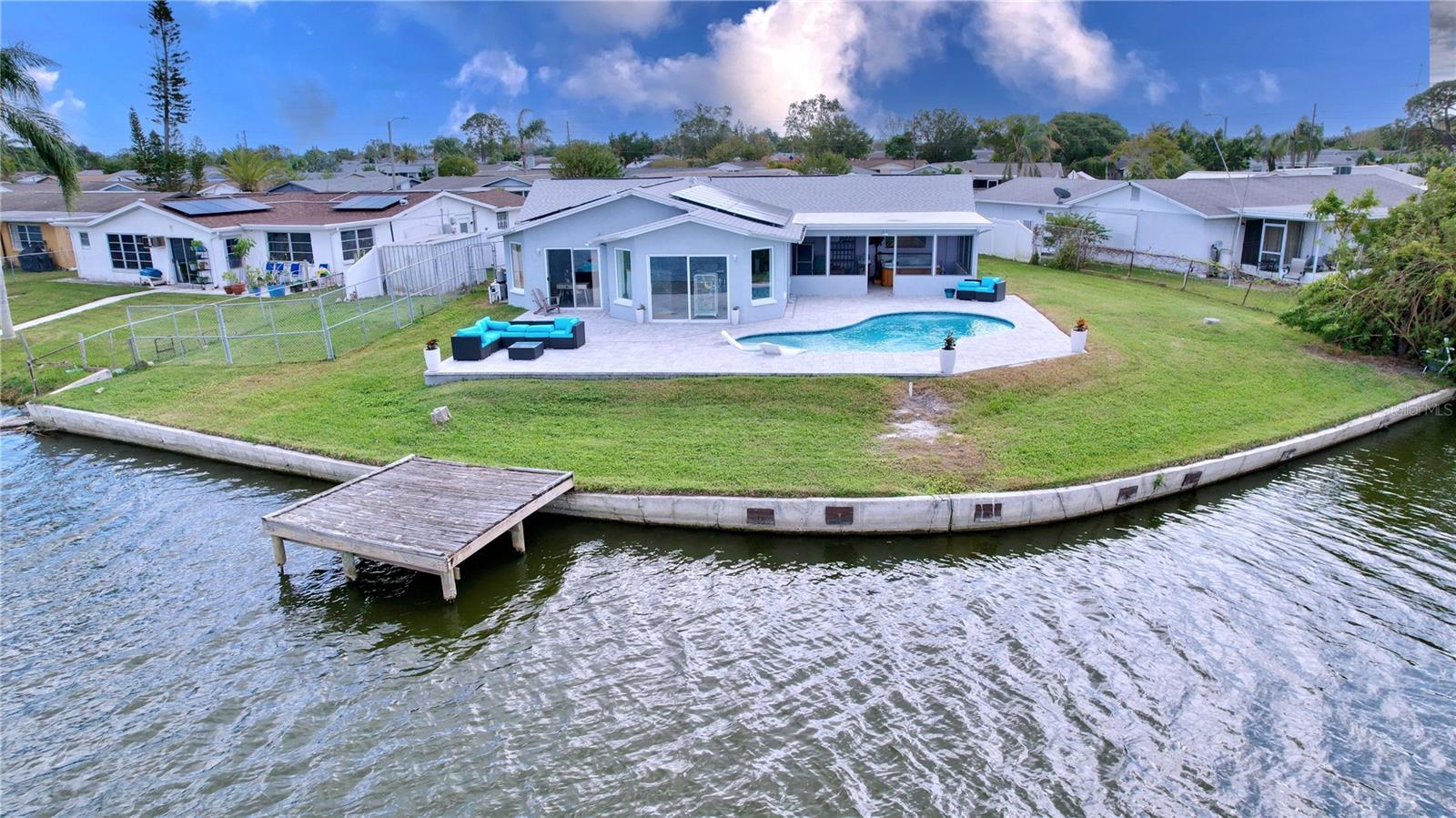 Waterfront property with large yard and greenspace.