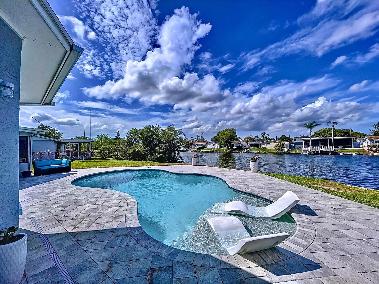 Relax poolside by the lake and take it all in.