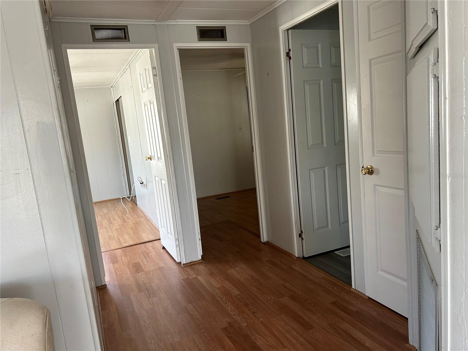 Hallway to primary, guest and hall bath