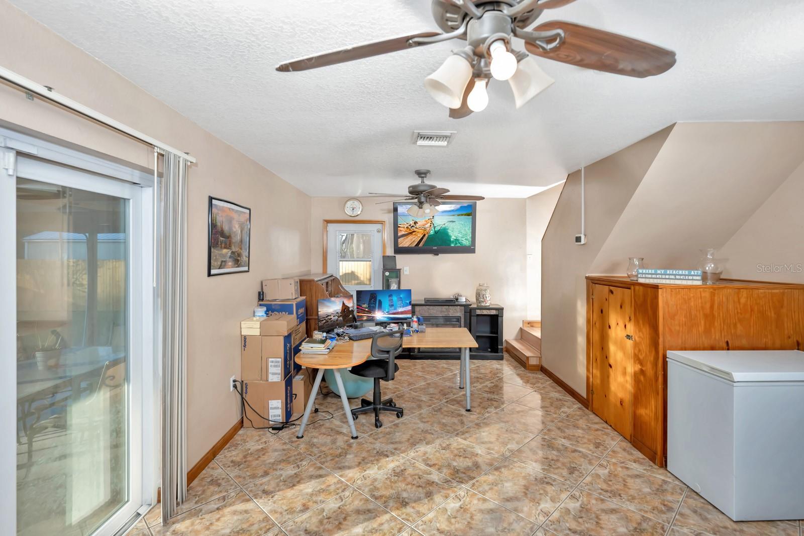 Bonus Room / Flex Room - Currently used as an Office. Built-in Cabinets for Additional Storage Under Stairway.