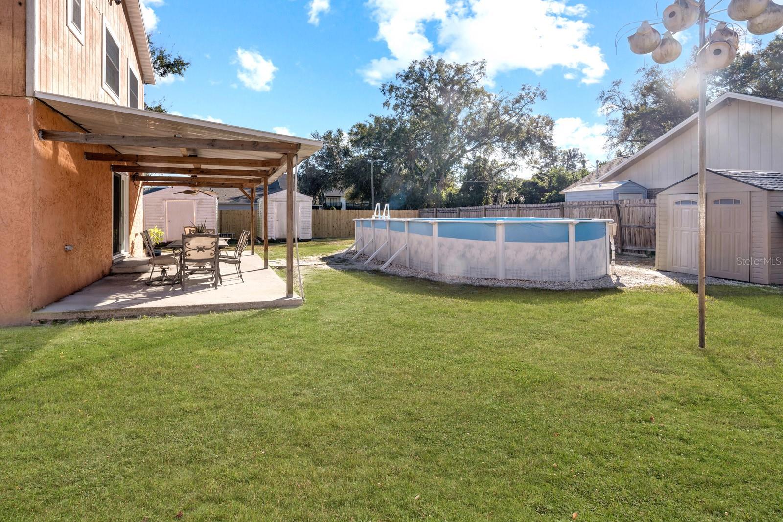 Large Yard for a Fire Pitt, a Gazebo, Playground, and Four-legged Family Members.