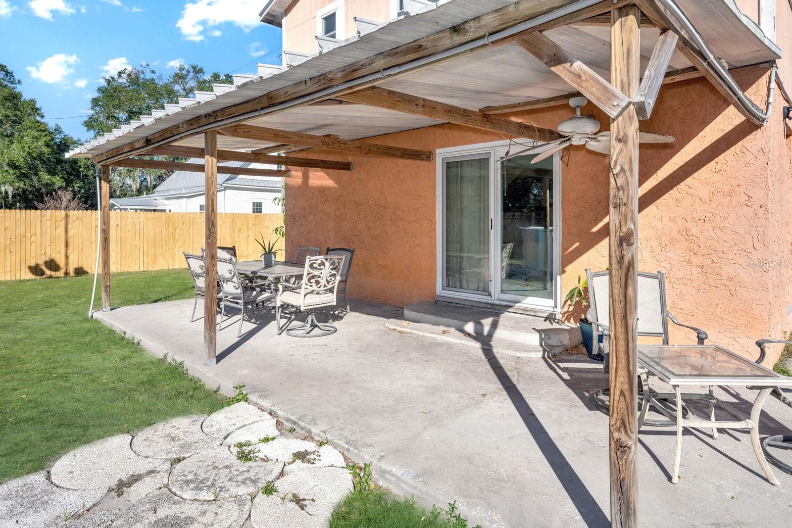 12X25 Covered Porch for Additional Outdoor Living Space Leading to the Pool Area.