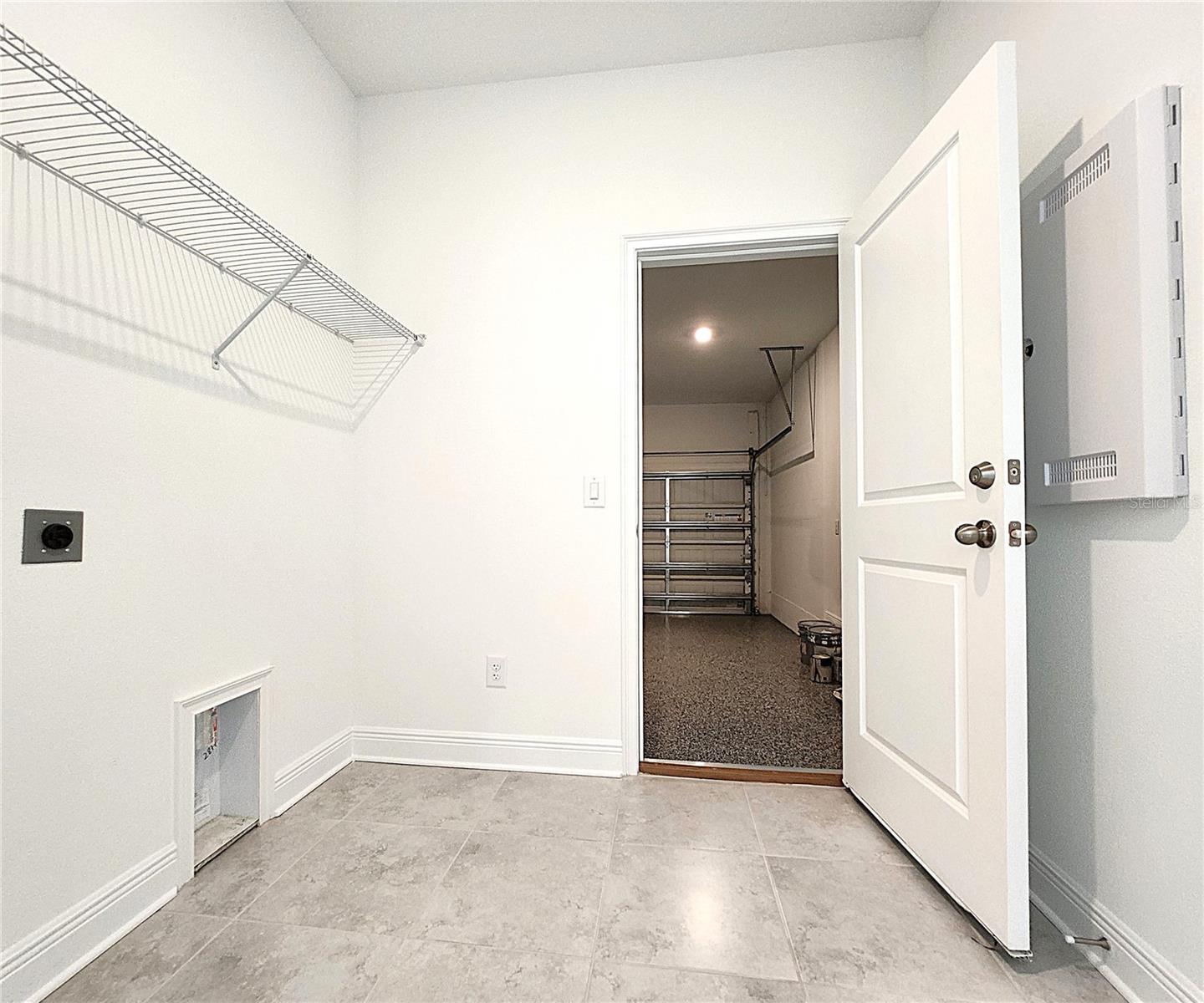 Inside Laundry Room includes hook-ups and cable management box