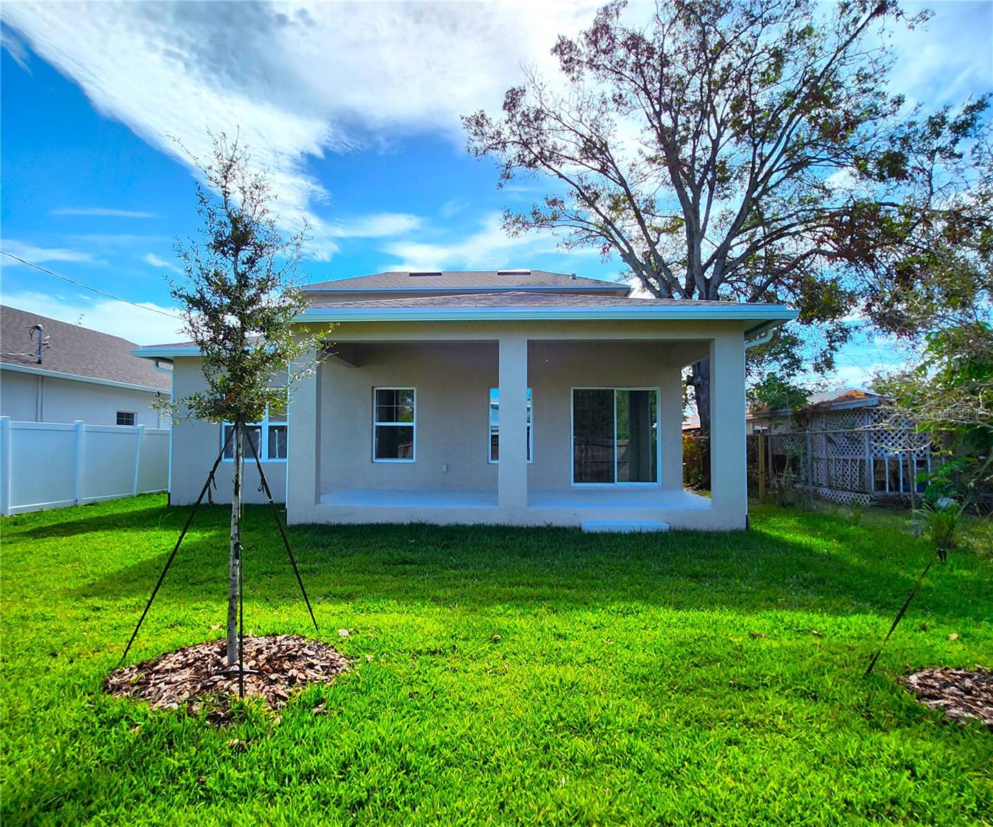 Oversized Covered Rear Porch with Stuccoed Floor