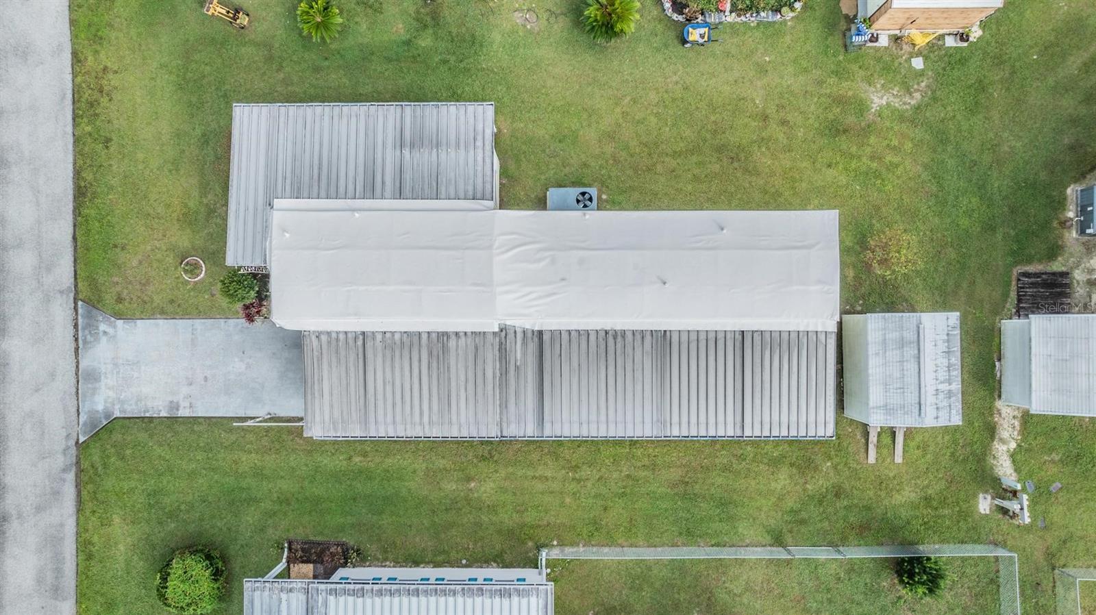 This home has a new TPO rubber roof in 2024 but did have minor carport damage from storm.