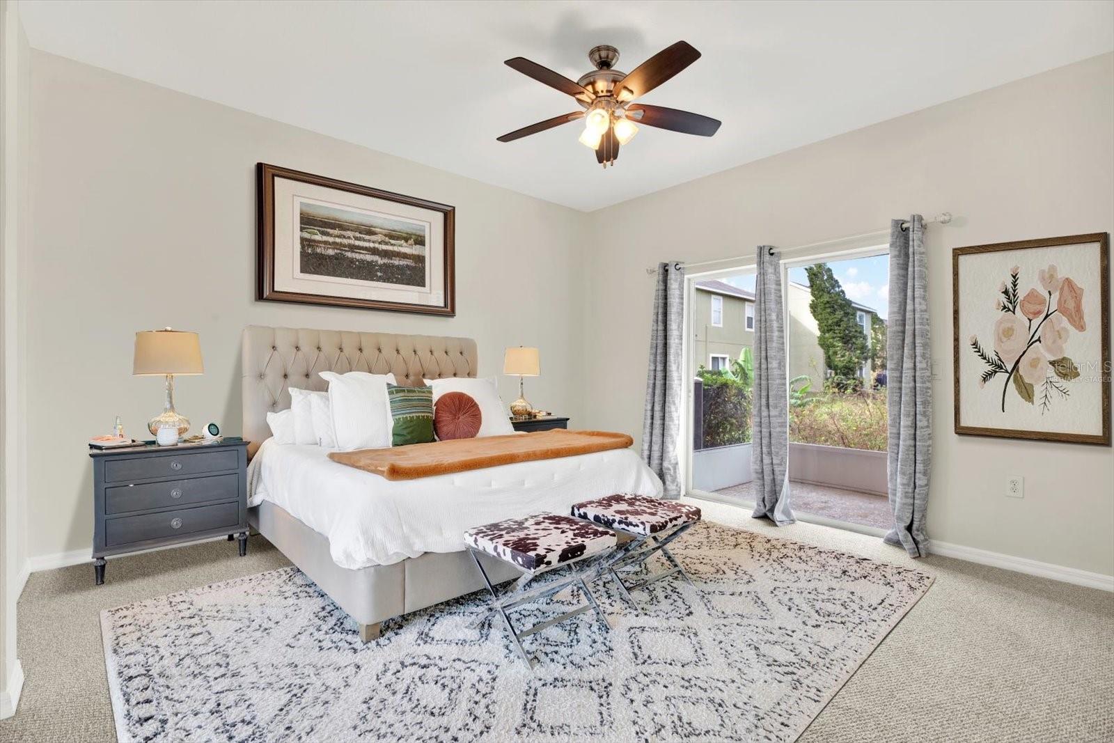 Primary Bedroom w/ Sliders to Patio (Virtually Staged)