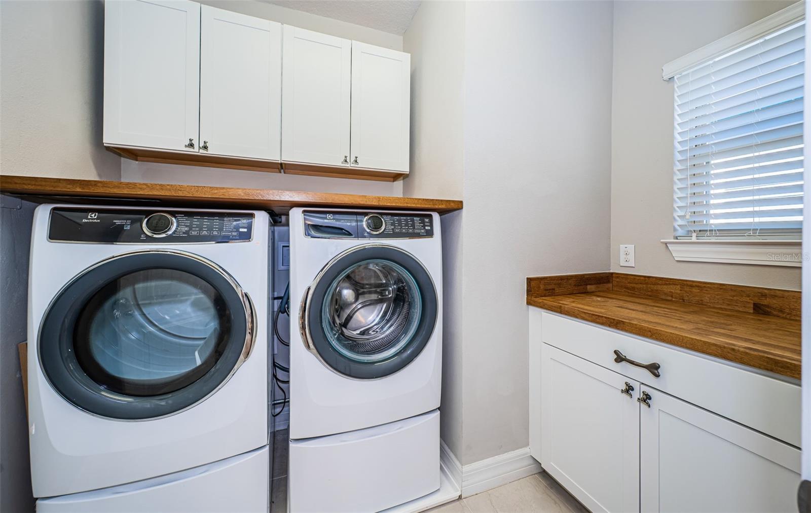 Upstairs laundry Room - Added cabinets