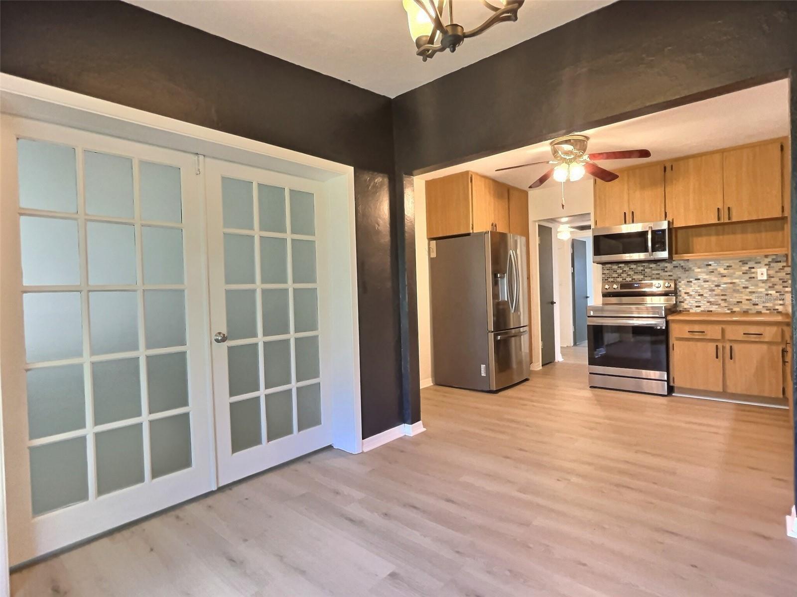 Dining area looking toward doors of bedroom 3 (or flex room) and kitchen