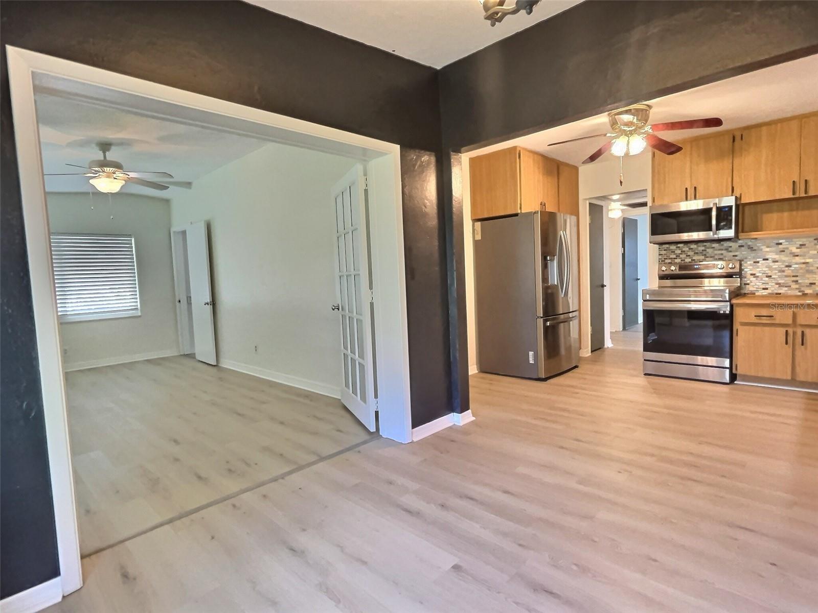 Dining area, doors to bedroom 3 open