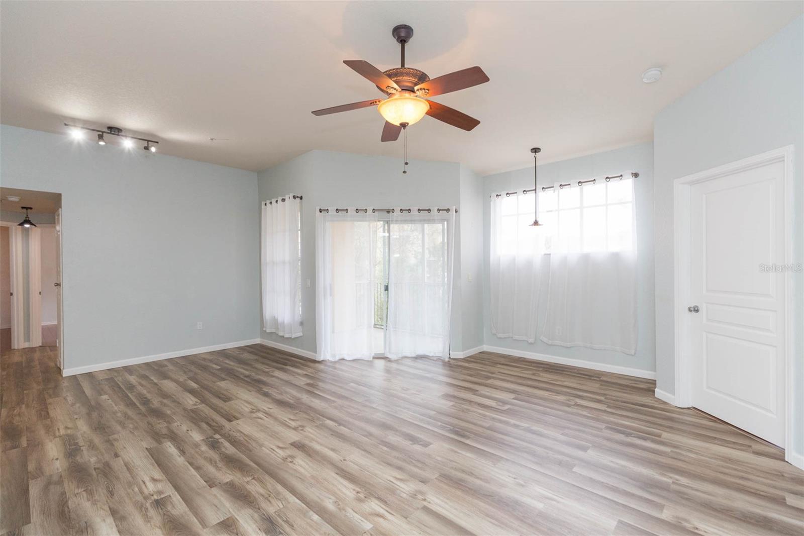 large living room open to kitchen and dining room