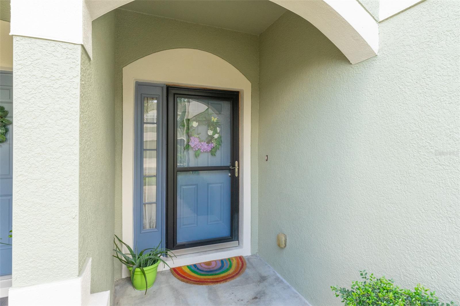 Front Entrance with Elegant Storm Door