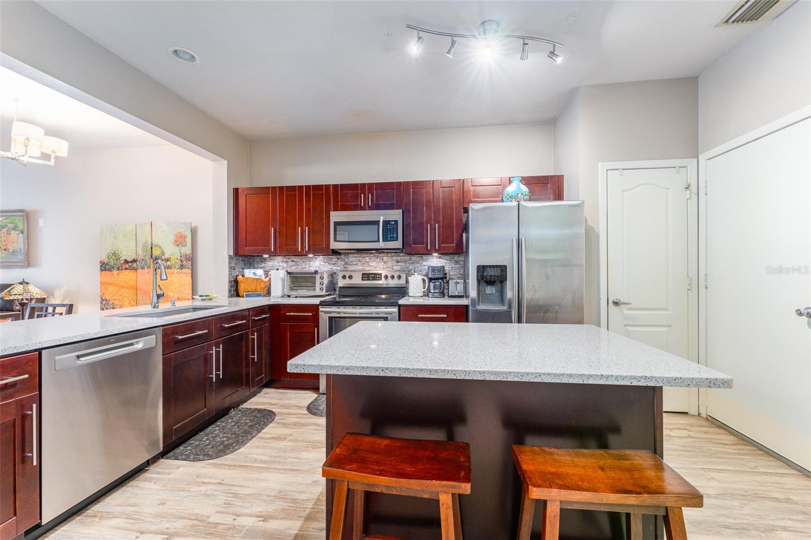 Lovely Updated Kitchen with Center Island, Seating & Additional Storage, Pretty Tile Backsplash