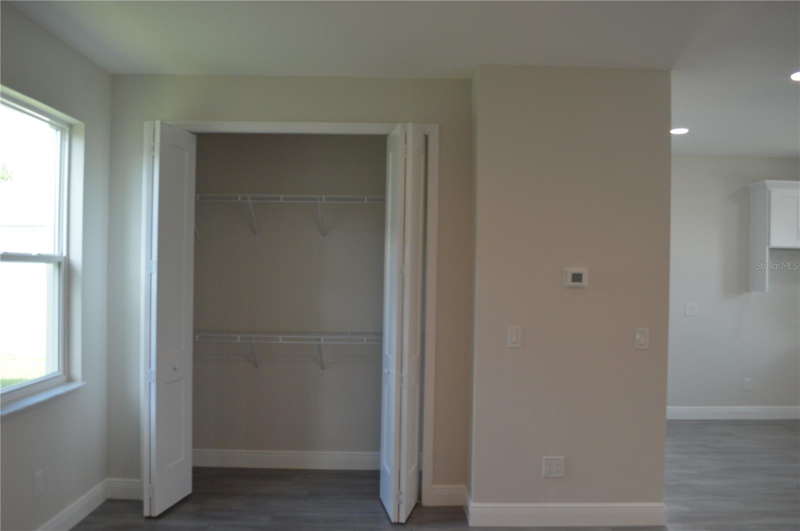 Door that leads to the front door entrance, garage door, and stairs.