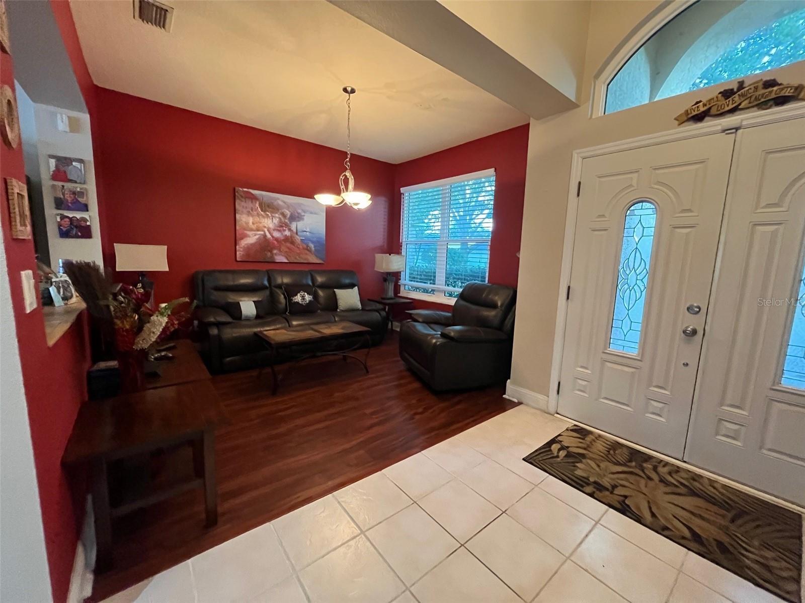 Formal living room.  This beautiful luxury vinyl plank flooring is installed in the living room, family room, dining room, master bedroom and the hallway.