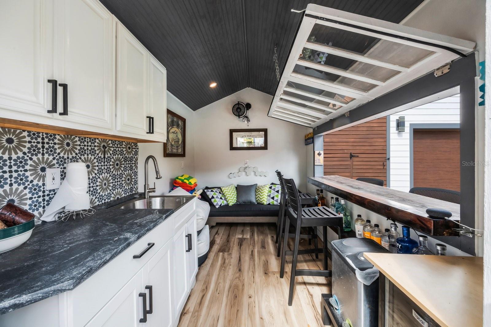 Wet Bar, Recessed Lighting and Wine Cooler.