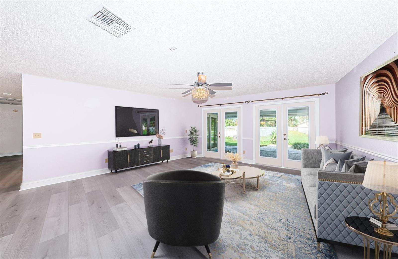 Virtually staged formal living room with hurricane french doors