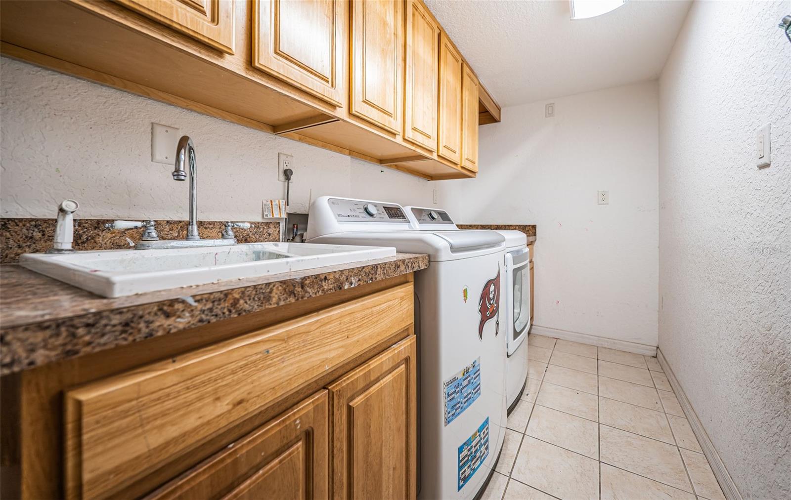 Laundry room with sink & storage.