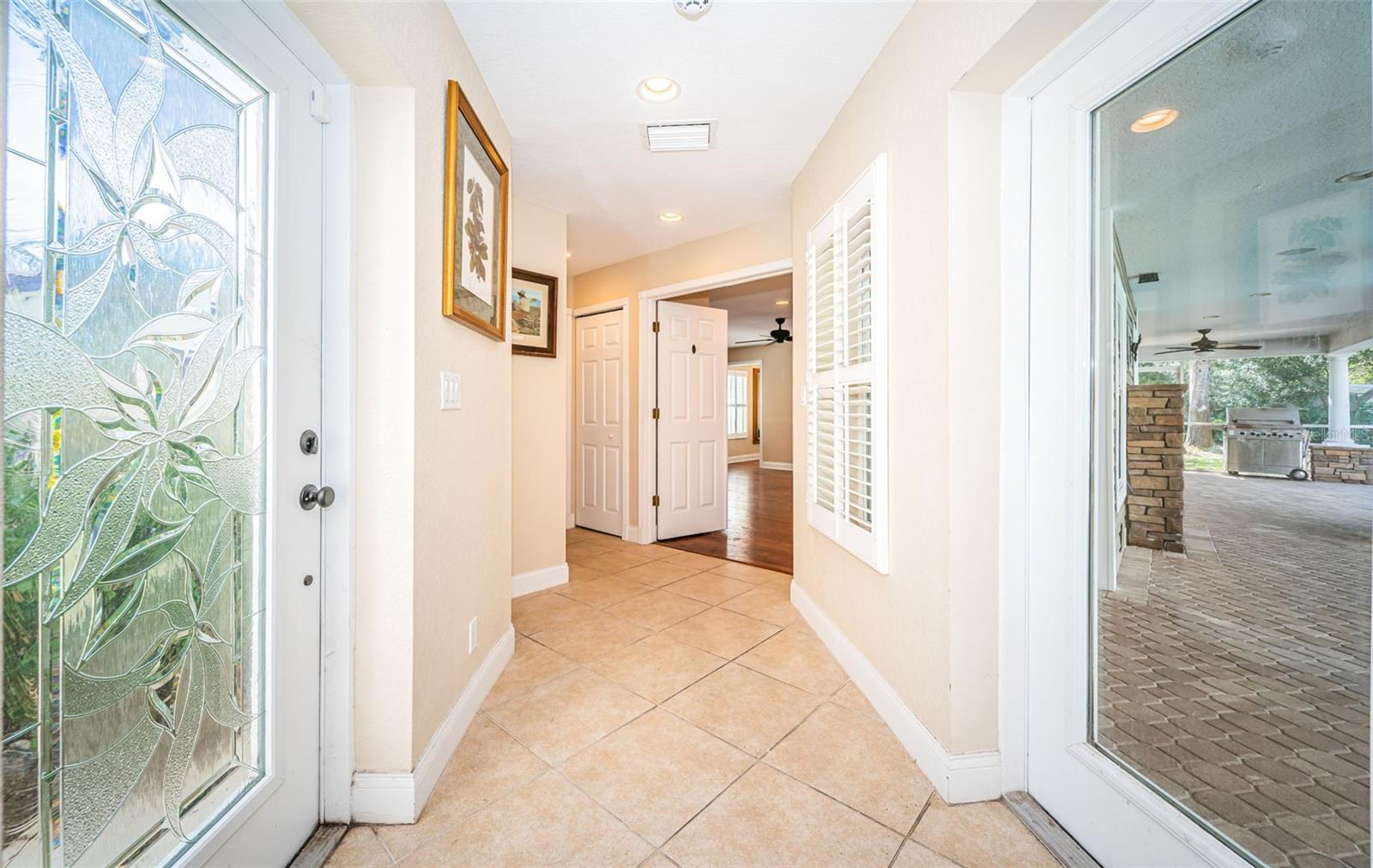 Hallway leading from living room to in-law suite.  Private entrance door on the left.