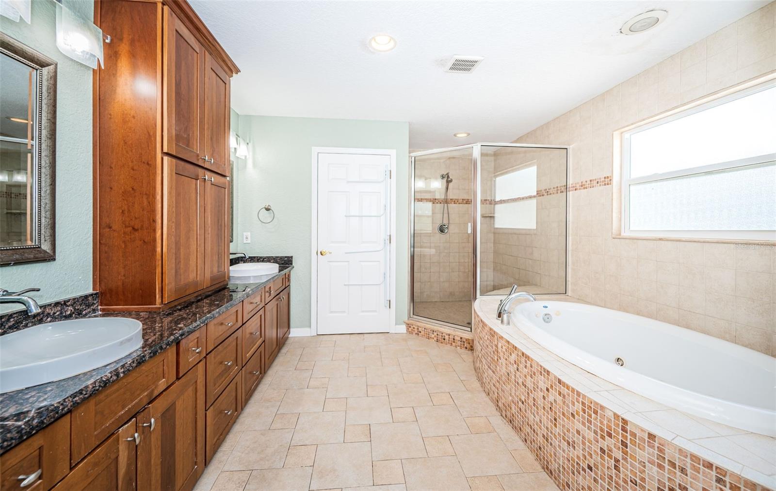 Primary ensuite bath with jetted tub & separate shower.