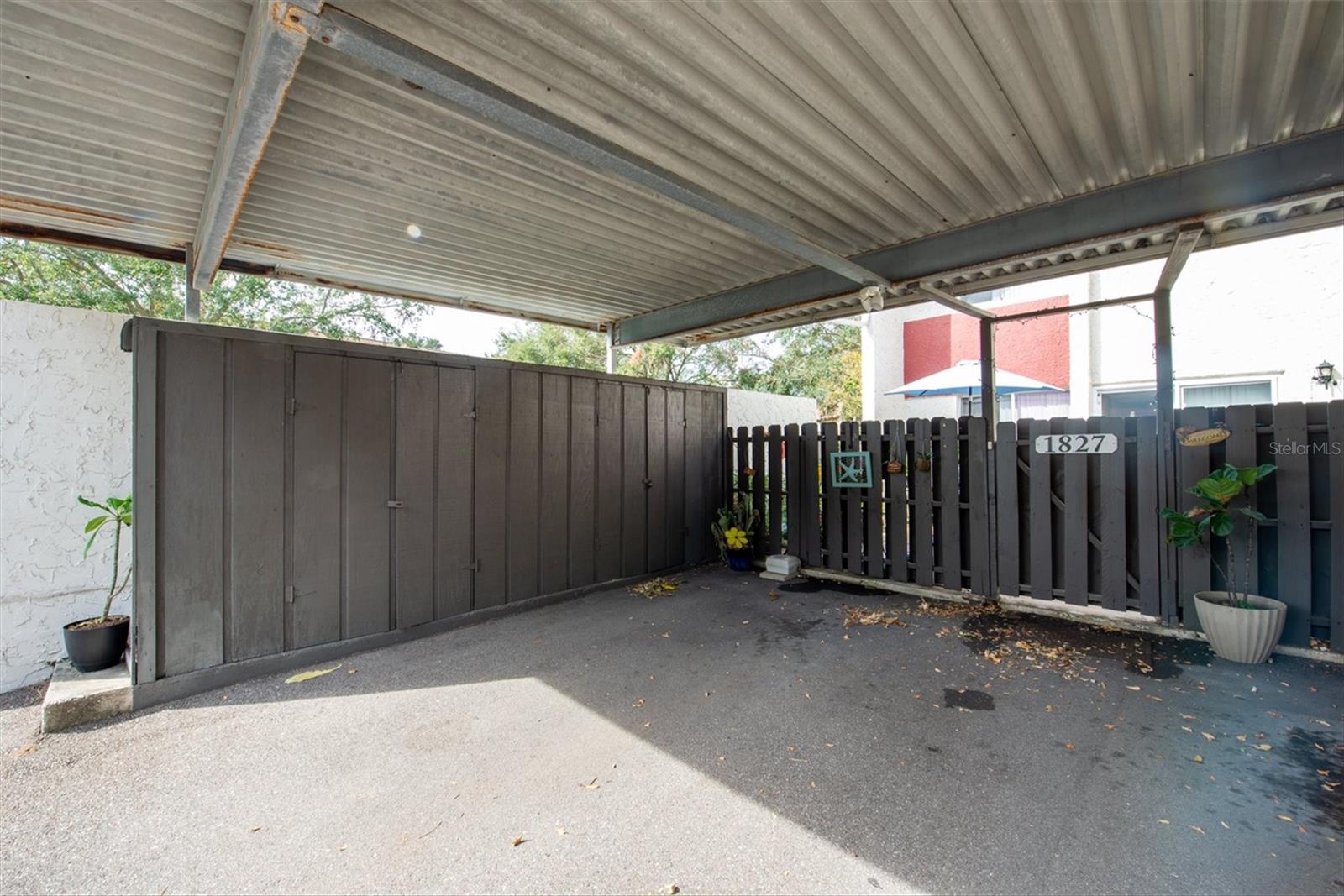 Carport with Locked Storage Closets