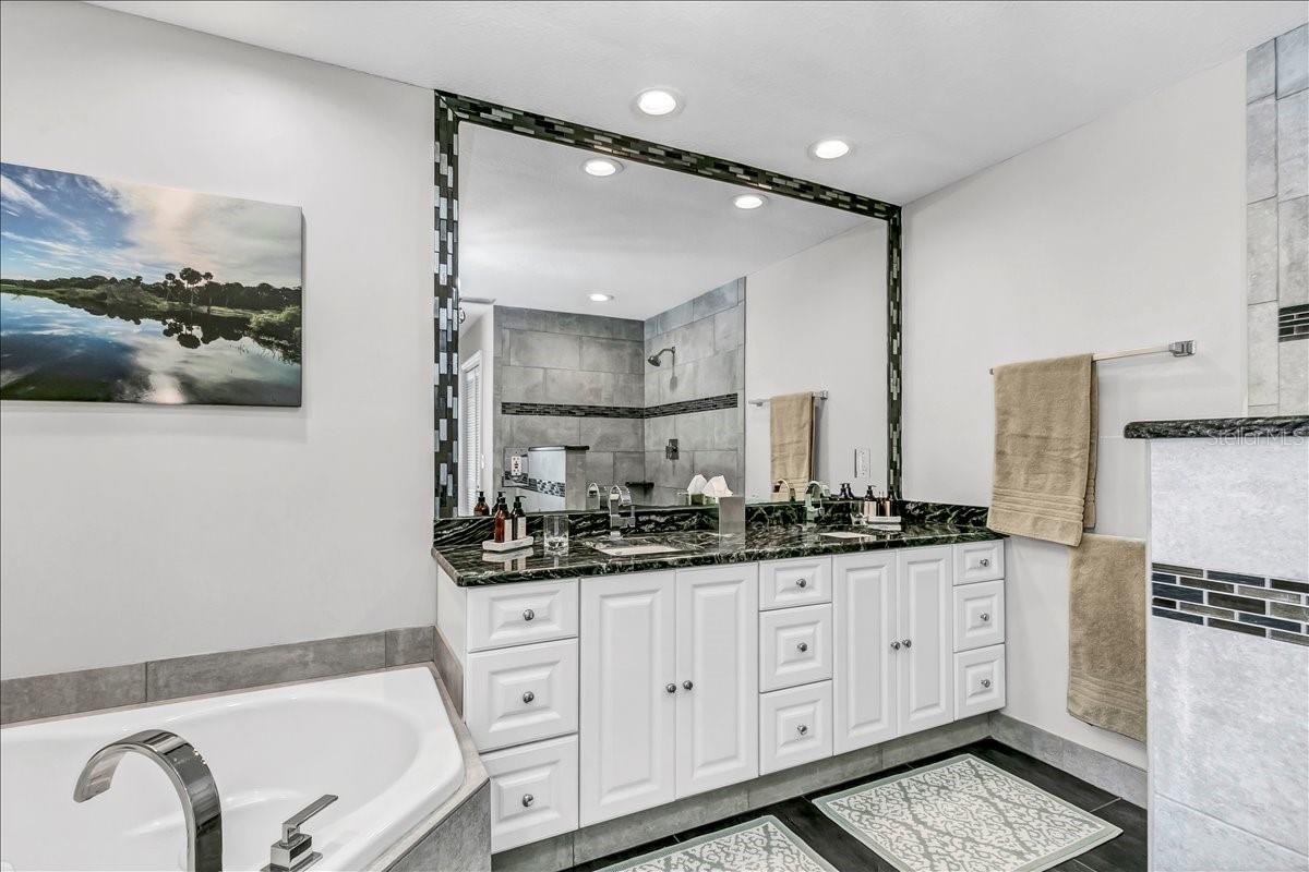 The spacious vanity featuring two sinks and ample storage capacity in the primary bathroom.