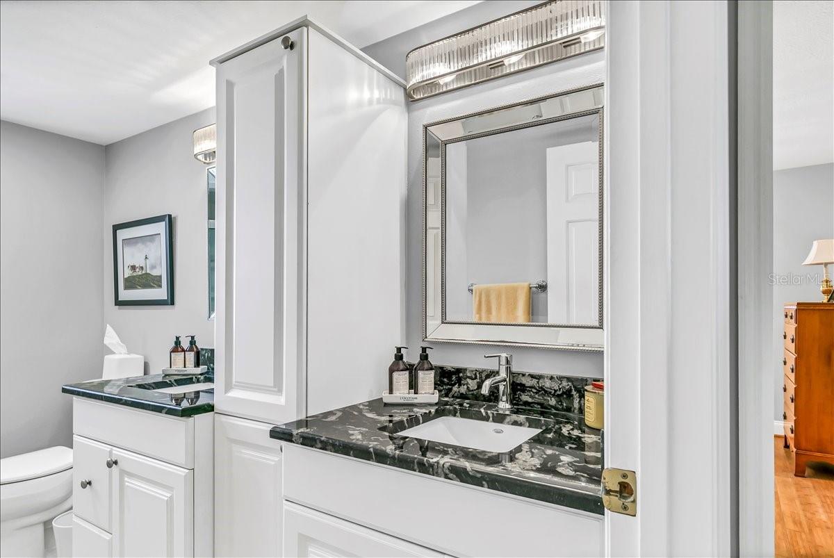 Other features of the second bathroom includes two sepertate vanities.