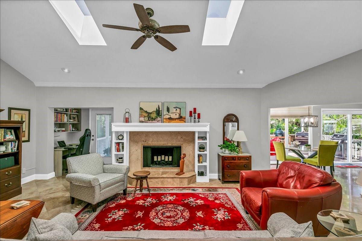 This main room has access to both the screened outdoor space and the kitchen