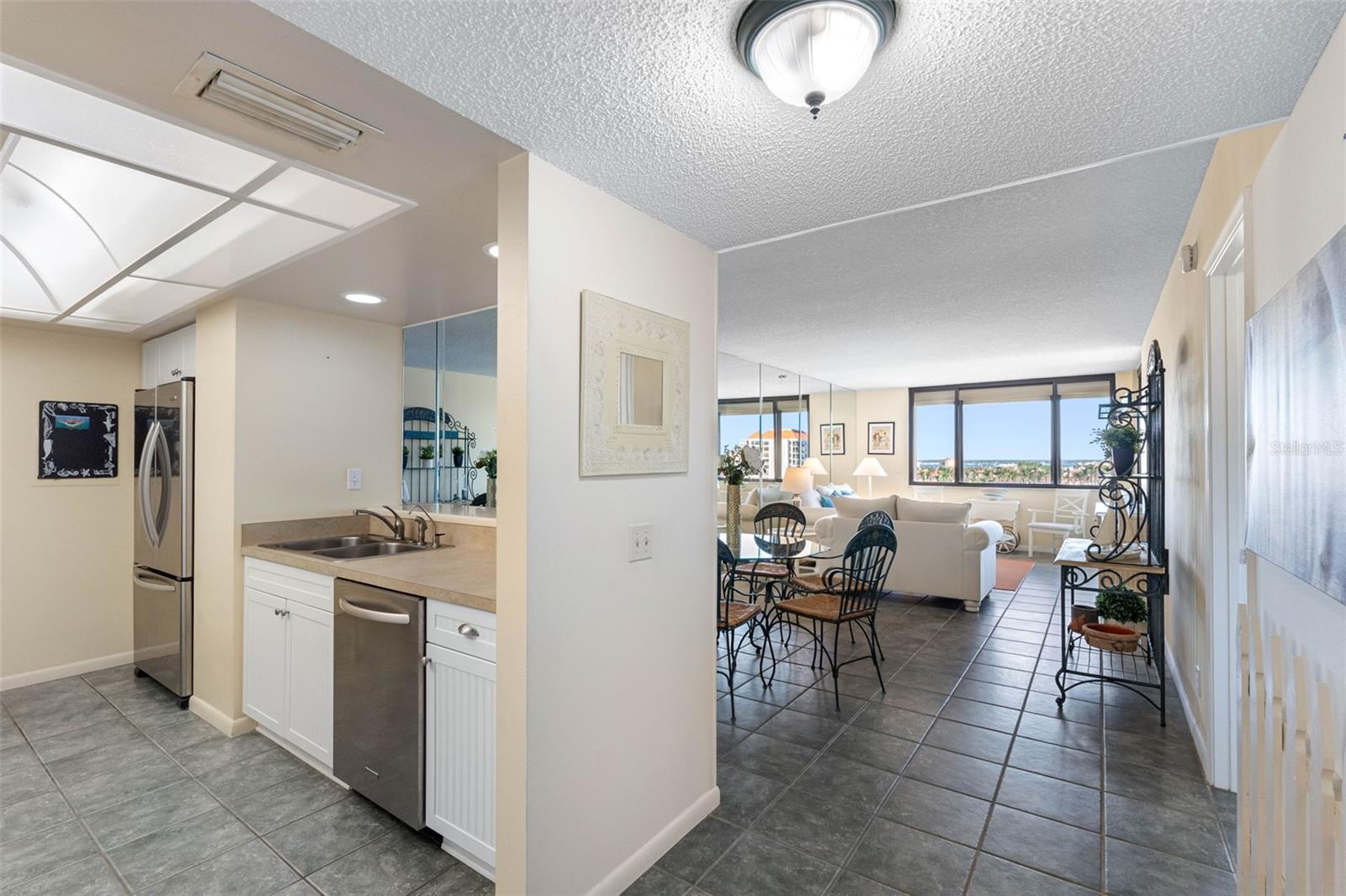 Light-filled and spacious, this living room offers unmatched views of Lake Bahia, Boca Ciega Bay and Downtown St. Pete.