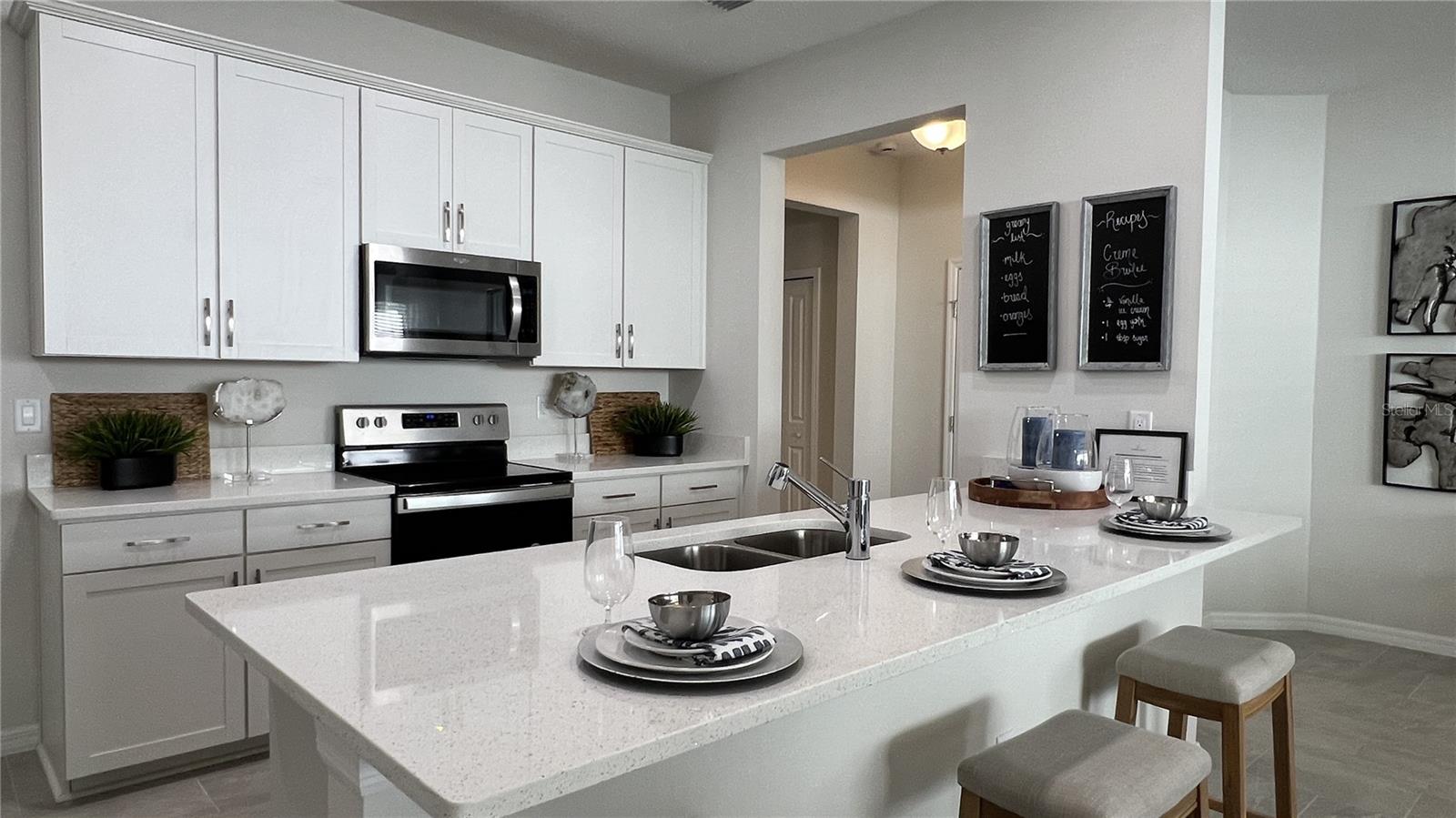 Estero Kitchen with Eating Bar! (stock photo of model home)